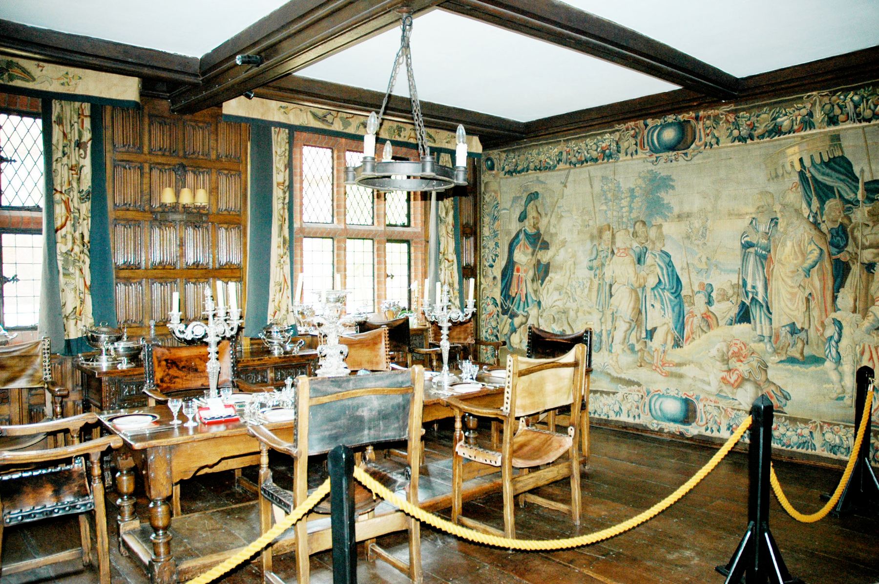 The Dining Room, oak panelled and hung with tapestries