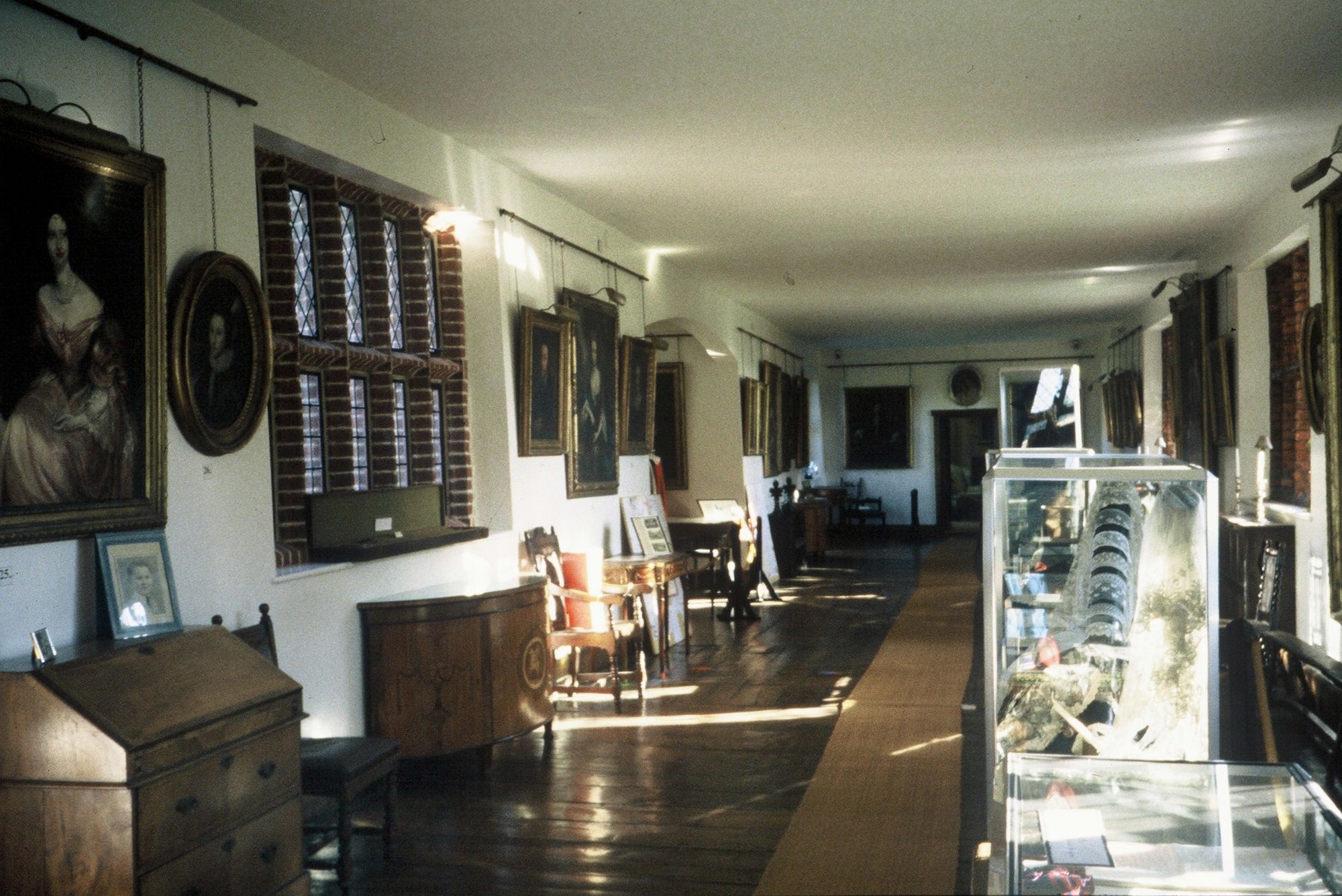 The Long Gallery, lined with Petre family portraits and display cases
